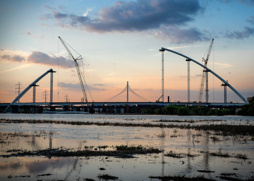 Construction in Dallas, TX on the new Margaret McDermott Bridge with the Margaret Hunt Hill standing tall in the background. Dallas, TX Bridges Margaret McDermott Bridge